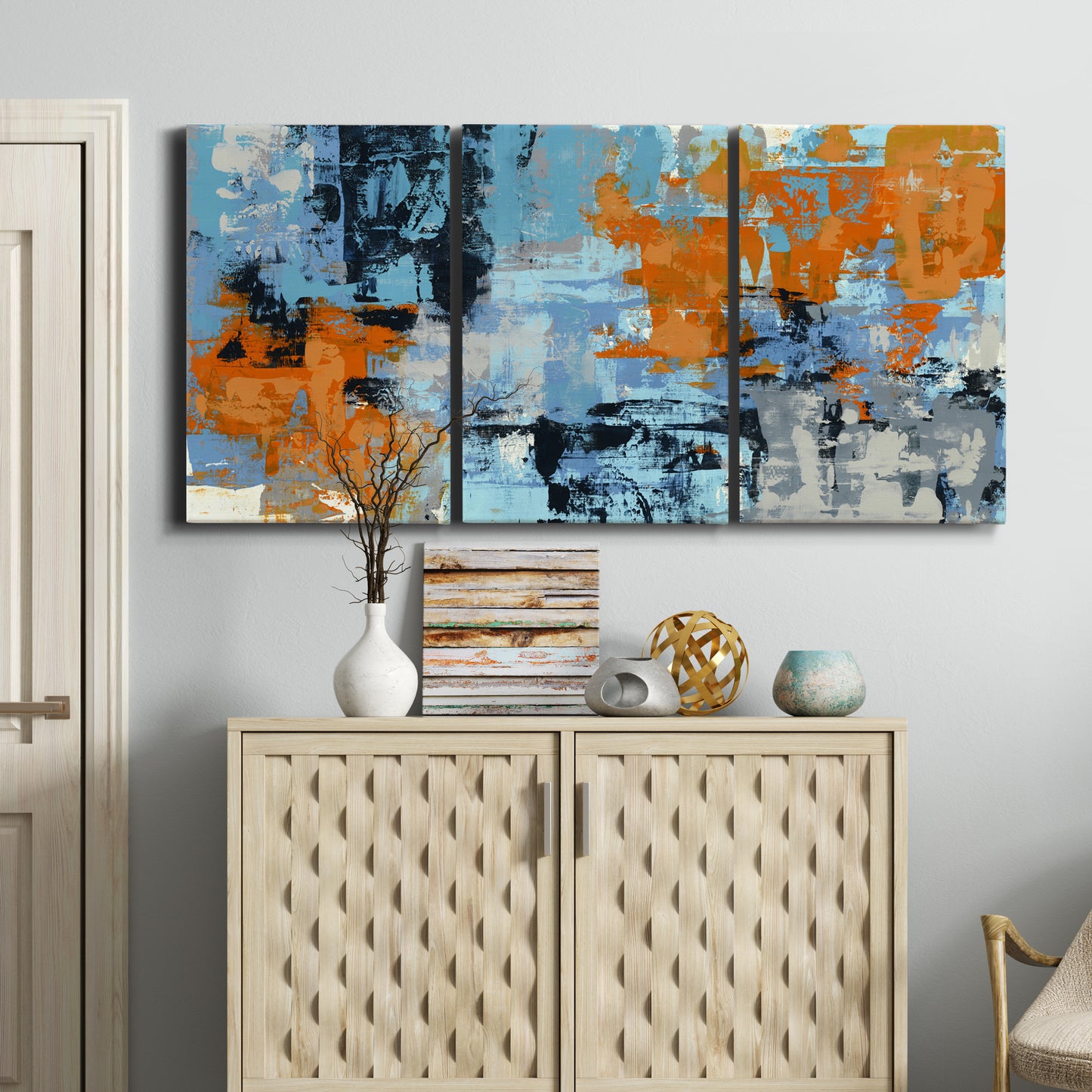 Three-panel canvas wall art featuring mid century abstract playground shapes, displayed above a cabinet in an entryway.