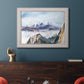 Impressionist alpine mountain landscape by John Singer Sargent in an ornate weathered white frame displayed in a dark-toned interior setting.