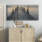 Three-panel canvas wall art featuring sunset over water photograph, displayed above a cabinet in an entryway.