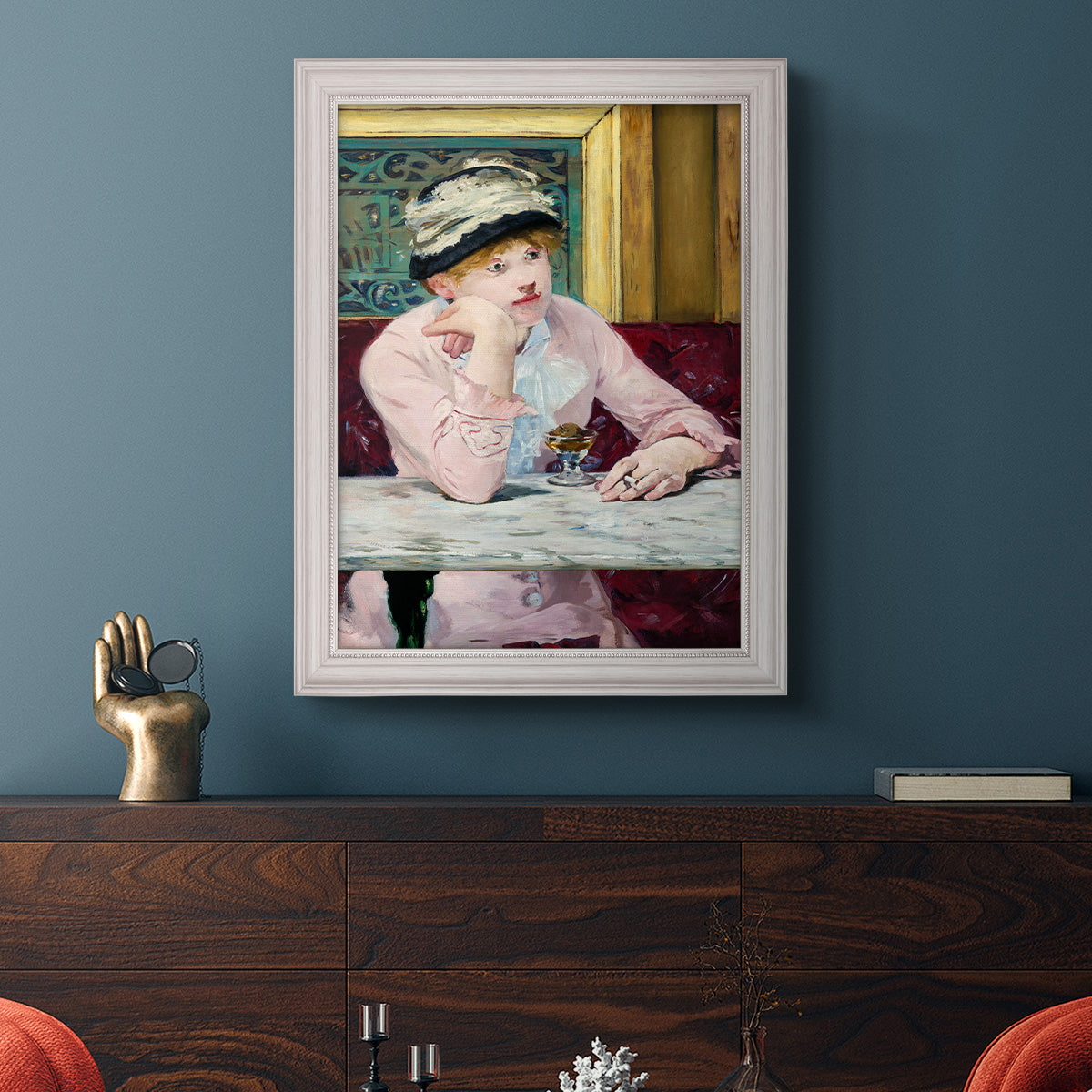 Impressionist portrait scene with plum brandy by Édouard Manet in an ornate weathered white frame displayed in a dark-toned interior setting.