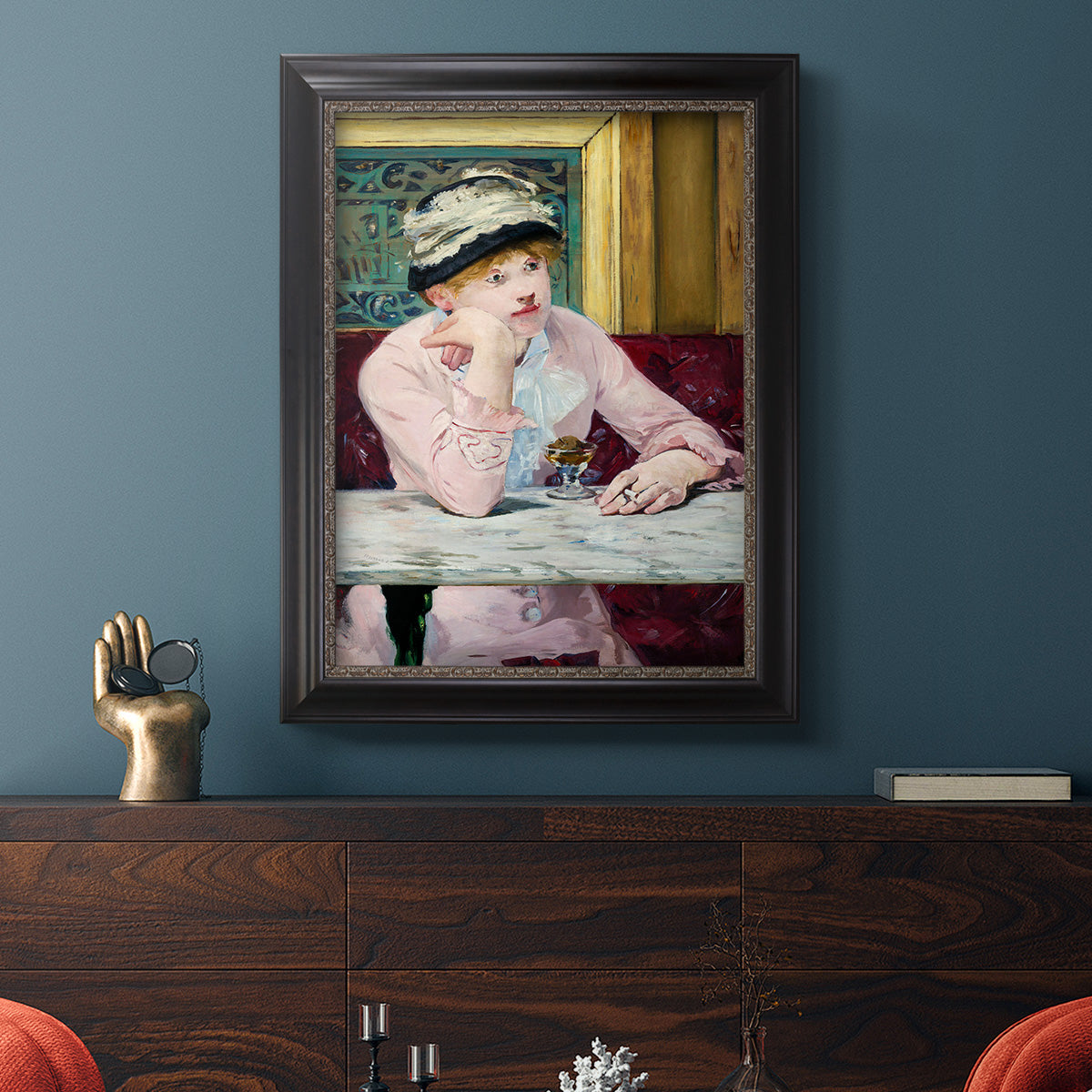 Impressionist portrait scene with plum brandy by Édouard Manet in an ornate black frame with gilded inner detail displayed in a dark-toned interior setting.