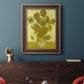 Impressionist sunflower still life painting by Vincent van Gogh in an ornate bronzed mahogany wood frame displayed in a dark-toned interior setting.