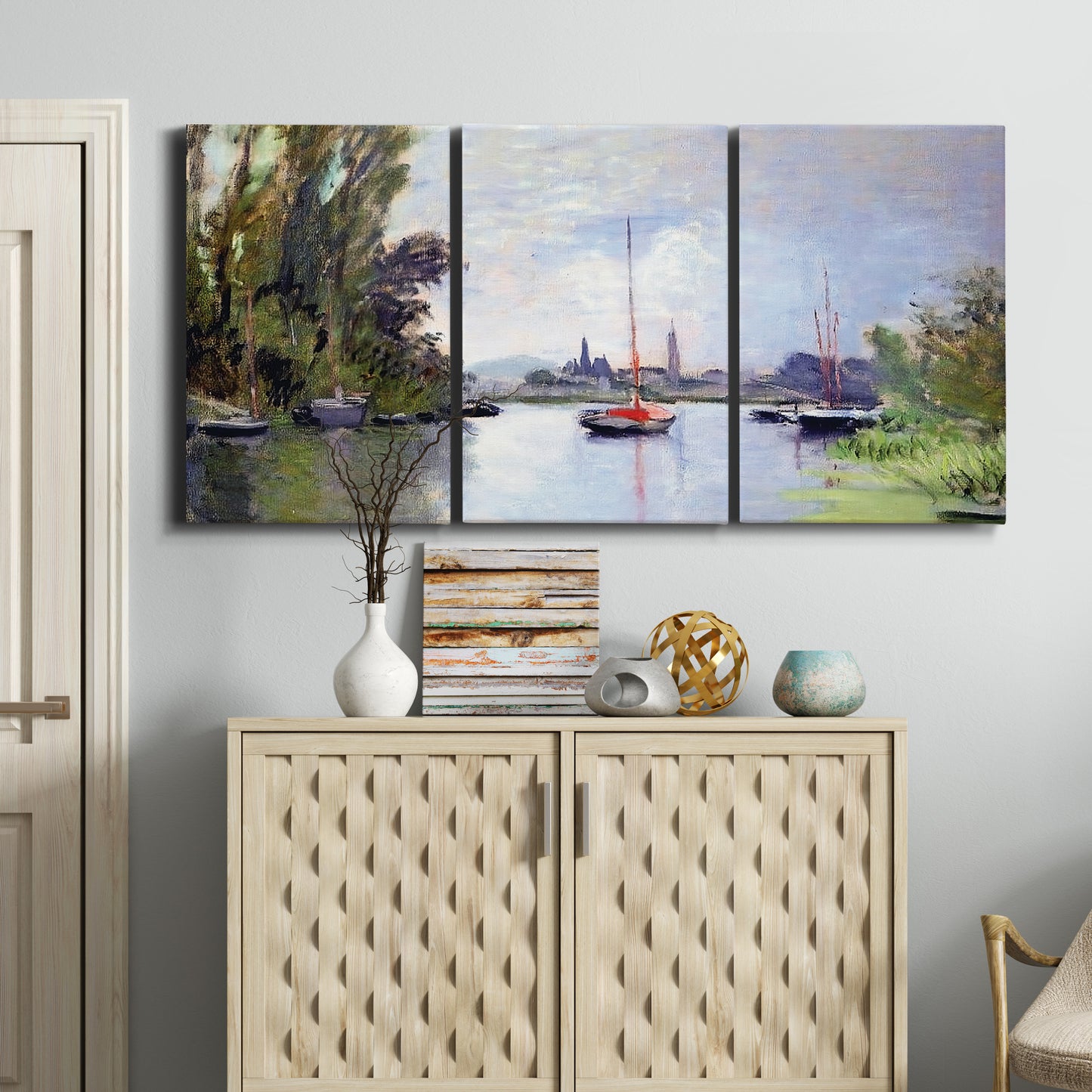 Three-panel canvas wall art featuring river view with boats and reflections, displayed above a cabinet in an entryway.