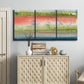 Three-panel canvas wall art featuring layered abstract color banding, displayed above a cabinet in an entryway.