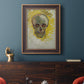 Expressive skull study painting by Vincent van Gogh in an ornate bronzed mahogany wood frame displayed in a dark-toned interior setting.