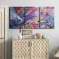 Three-panel canvas wall art featuring expressive abstract with layered color, displayed above a cabinet in an entryway.