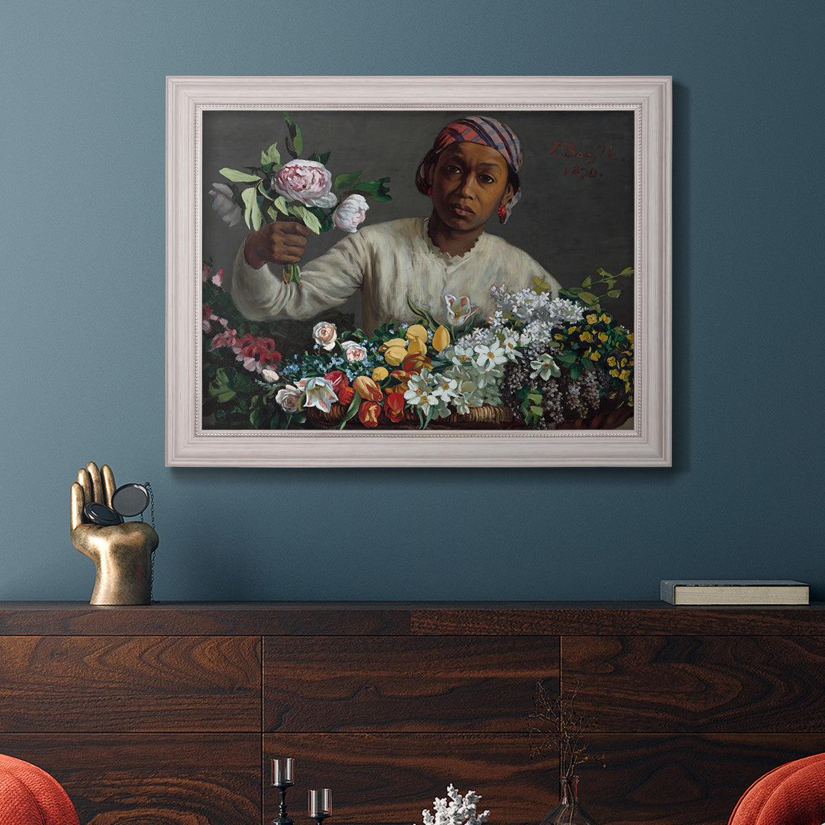 Traditional portrait of a woman holding peonies by Frédéric Bazille in an ornate weathered white frame displayed in a dark-toned interior setting.