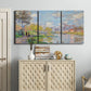 Three-panel canvas wall art featuring formal city park with trees, displayed above a cabinet in an entryway.