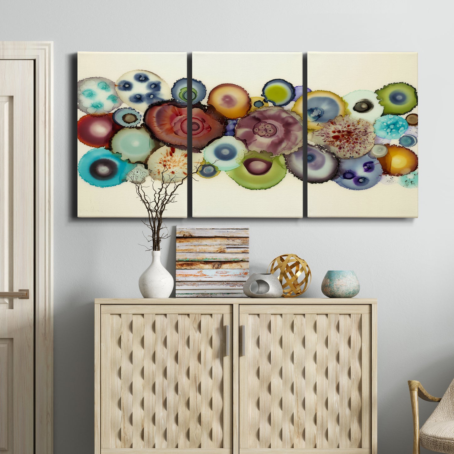 Three-panel canvas wall art featuring mid century geometric red pathway, displayed above a cabinet in an entryway.