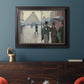 Impressionist urban street scene in the rain by Gustave Caillebotte in an ornate black frame with gilded inner detail displayed in a dark-toned interior setting.