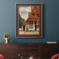 Realist city street scene by Johannes Vermeer in an ornate bronzed mahogany wood frame displayed in a dark-toned interior setting.