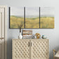 Three-panel canvas wall art featuring pastoral wheat field landscape, displayed above a cabinet in an entryway.