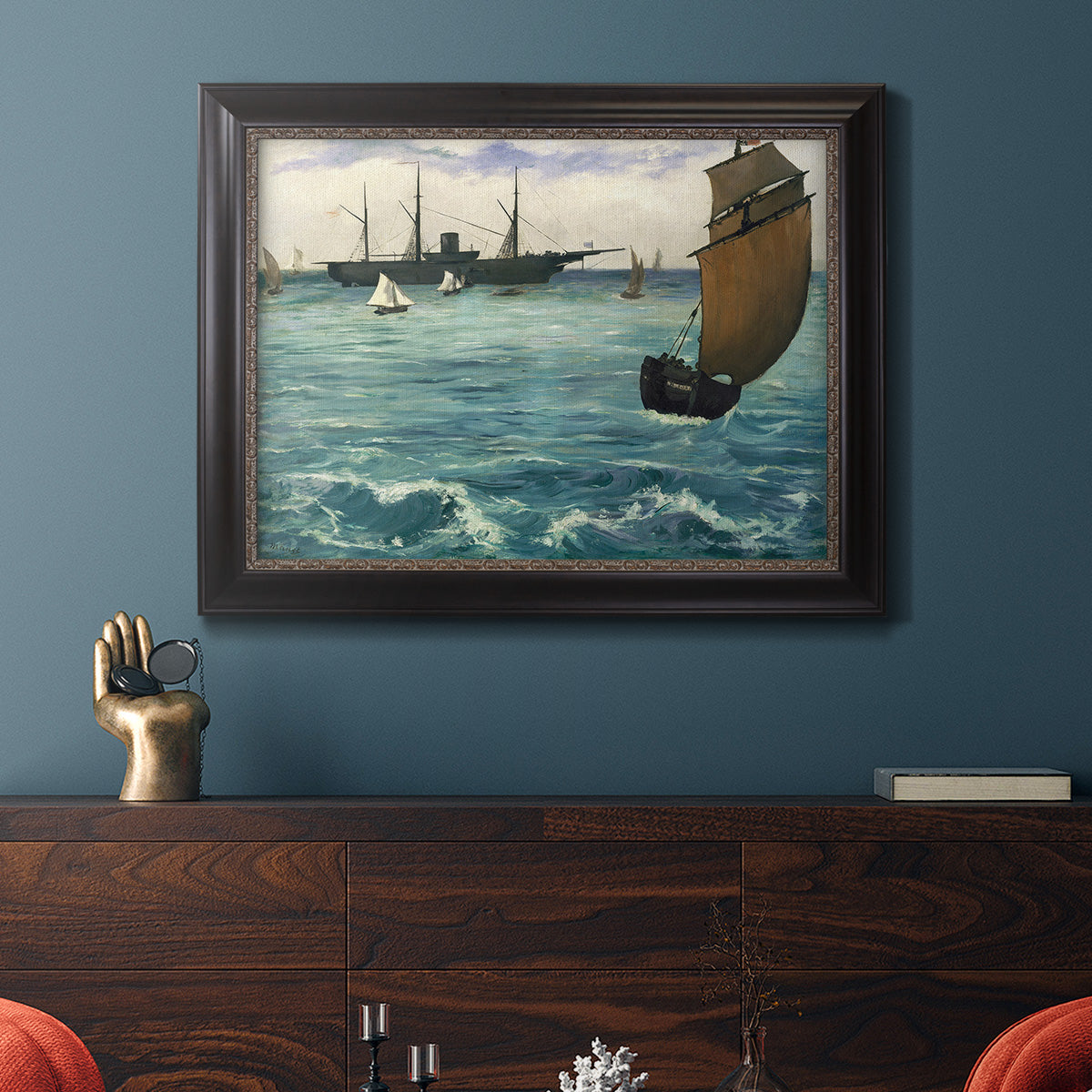 Impressionist naval seascape with the Kearsarge by Édouard Manet in an ornate black frame with gilded inner detail displayed in a dark-toned interior setting.