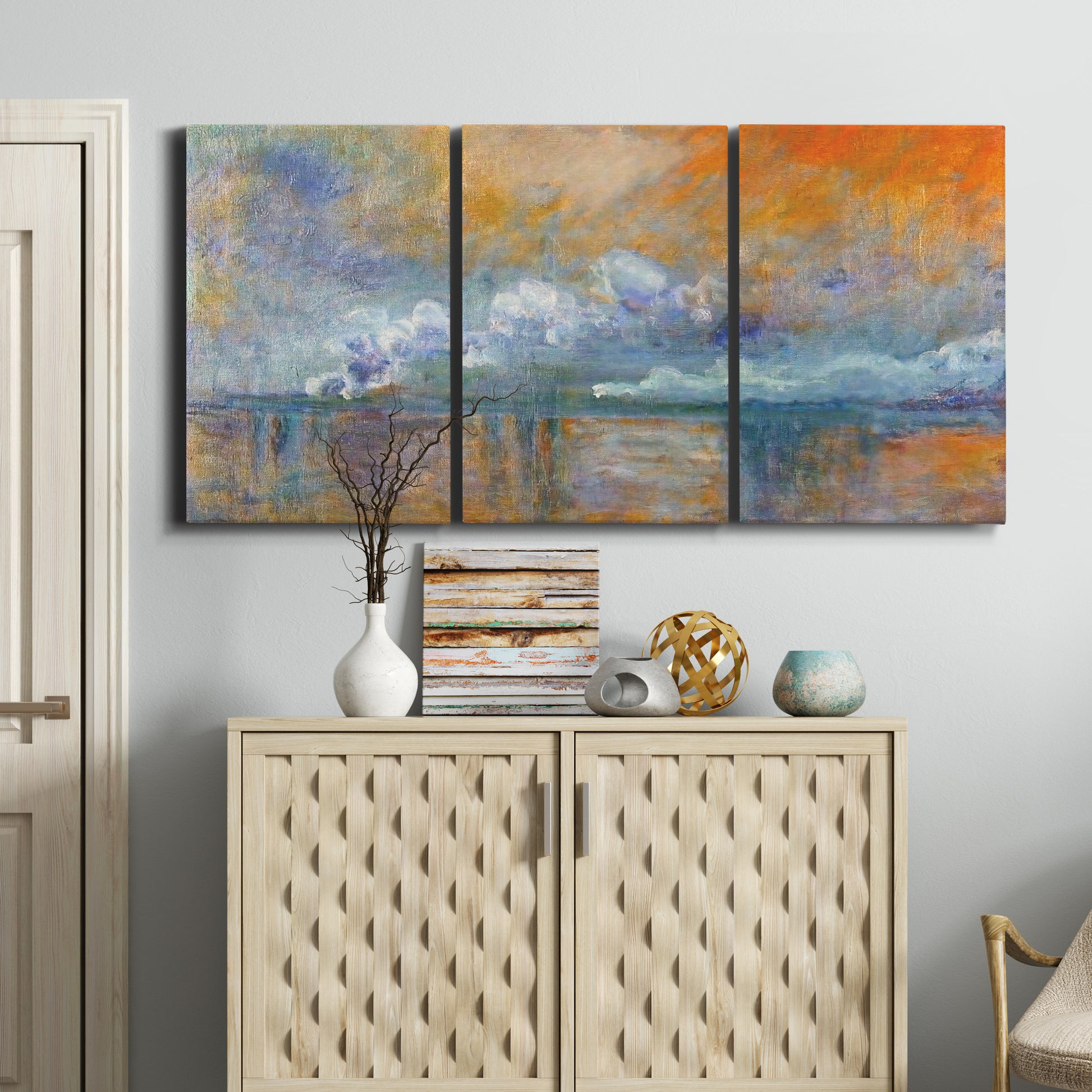 Three-panel canvas wall art featuring bridge shrouded in fog and smoke, displayed above a cabinet in an entryway.
