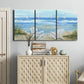 Three-panel canvas wall art featuring peaceful coastal landscape escape, displayed above a cabinet in an entryway.