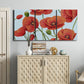 Three-panel canvas wall art featuring red poppies in motion, displayed above a cabinet in an entryway.