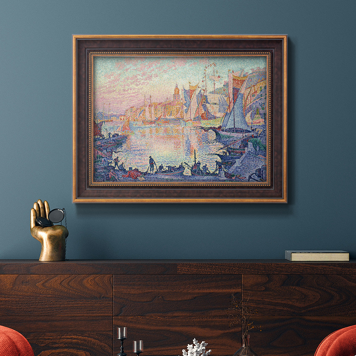 Impressionist Mediterranean harbor painting by Paul Signac in an ornate bronzed mahogany wood frame displayed in a dark-toned interior setting.