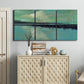 Three-panel canvas wall art featuring calm harbor water with glowing horizon, displayed above a cabinet in an entryway.