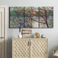 Three-panel canvas wall art featuring riverside park with figures and trees, displayed above a cabinet in an entryway.