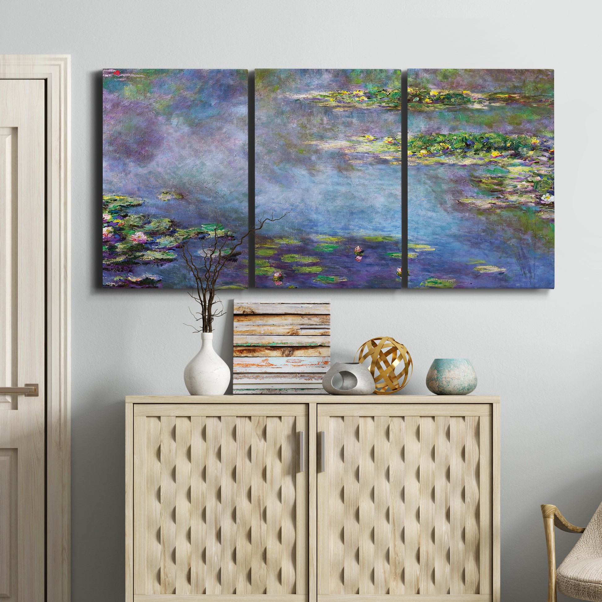 Three-panel canvas wall art featuring water lilies emerging through mist, displayed above a cabinet in an entryway.