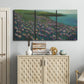 Three-panel canvas wall art featuring calm coastal landscape sanctuary, displayed above a cabinet in an entryway.