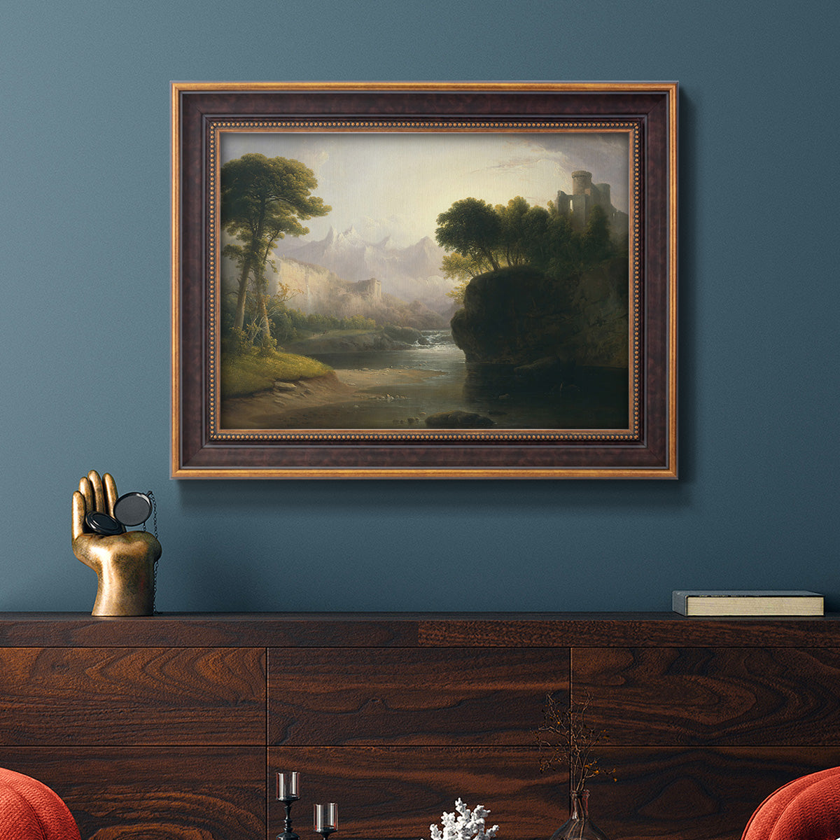 Romantic autumn landscape along the Hudson River by Thomas Doughty in an ornate bronzed mahogany wood frame displayed in a dark-toned interior setting.