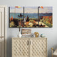 Three-panel canvas wall art featuring coastal garden overlooking sea, displayed above a cabinet in an entryway.