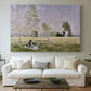 Canvas art print detailing a tranquil summer landscape with lone figure in nature, centered above a sofa as a large focal wall piece