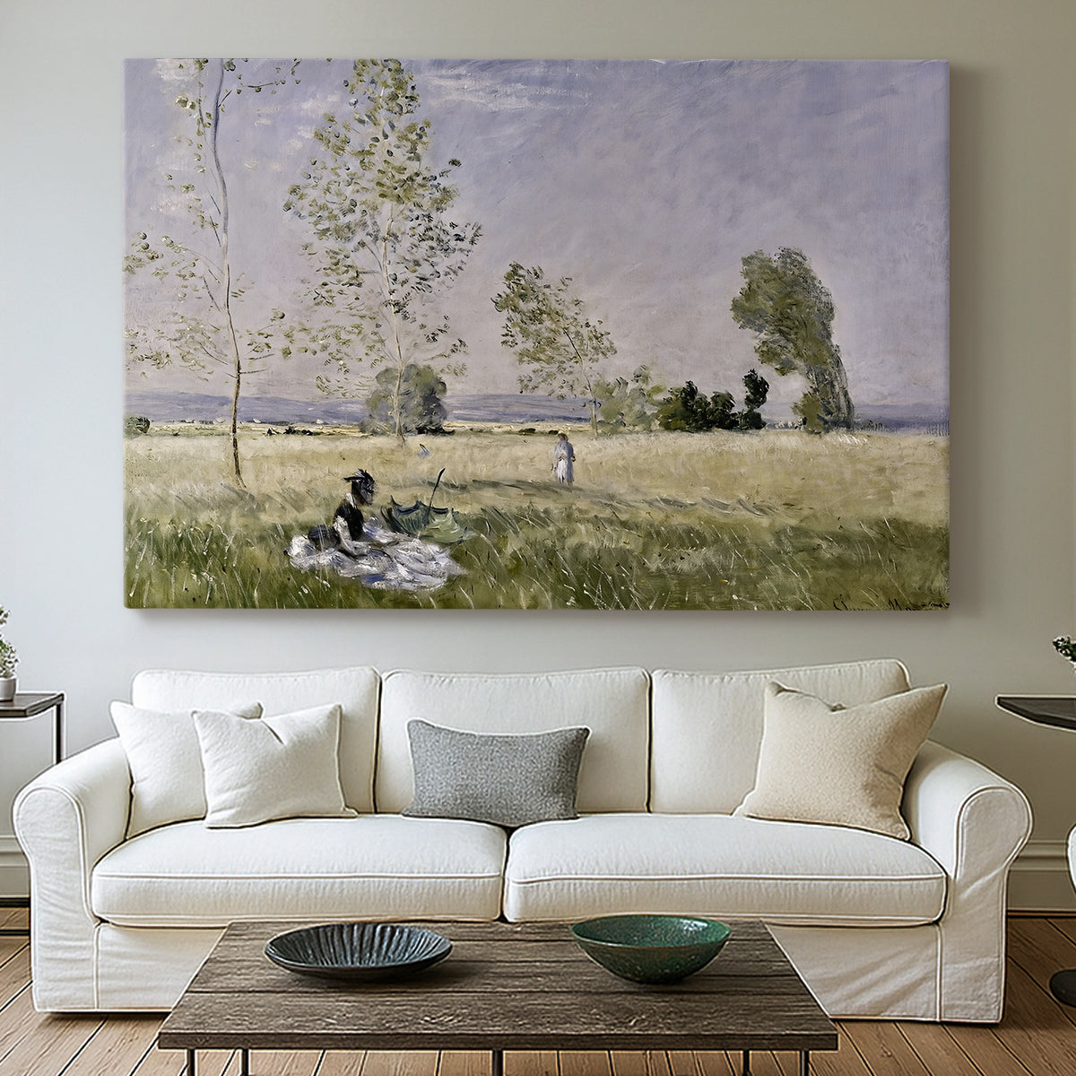 Canvas art print detailing a tranquil summer landscape with lone figure in nature, centered above a sofa as a large focal wall piece