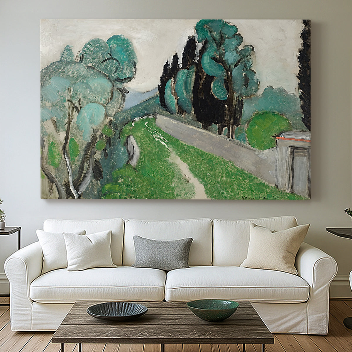 Canvas art print detailing a bright natural view with cypress and olive trees, centered above a sofa as a large focal wall piece