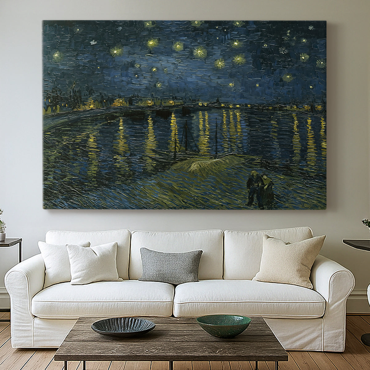 Canvas art print detailing a nocturnal landscape emphasizing contrast between lights and dark water, centered above a sofa as a large focal wall piece