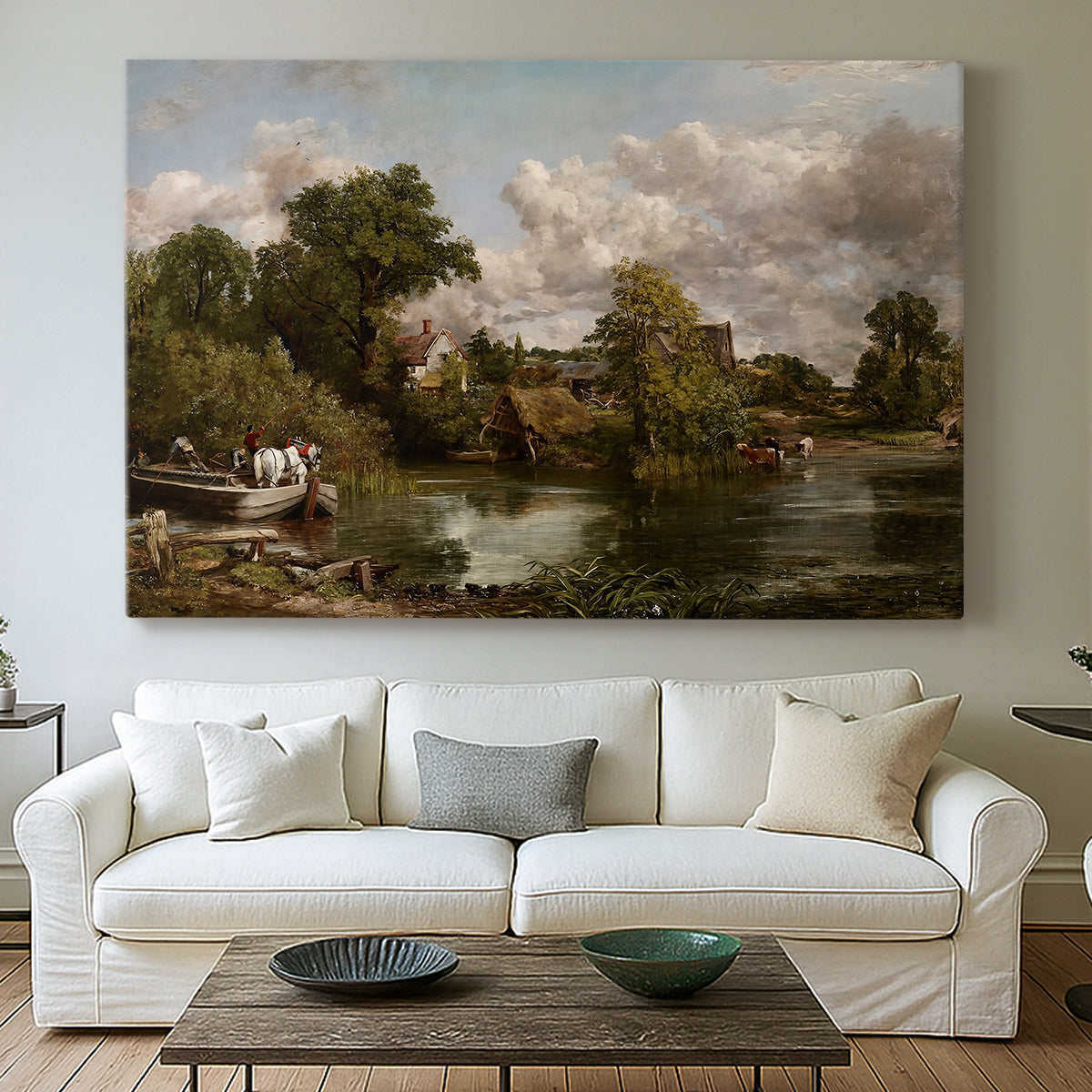Canvas art print detailing a traditional rural composition with horse and trees, centered above a sofa as a large focal wall piece