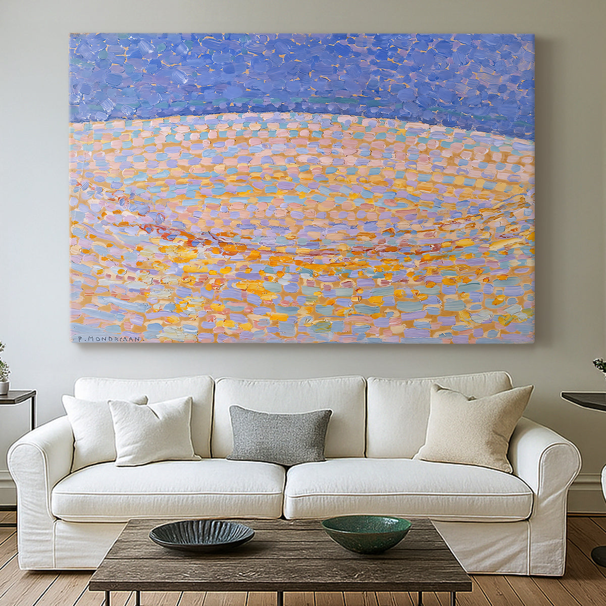 Canvas art print detailing a simplified landscape using texture and color variation, centered above a sofa as a large focal wall piece