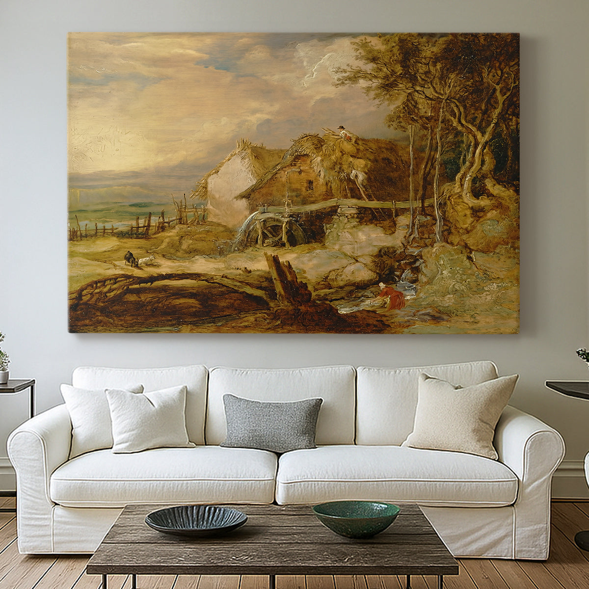 Canvas art print detailing a landscape featuring mill and natural terrain, centered above a sofa as a large focal wall piece