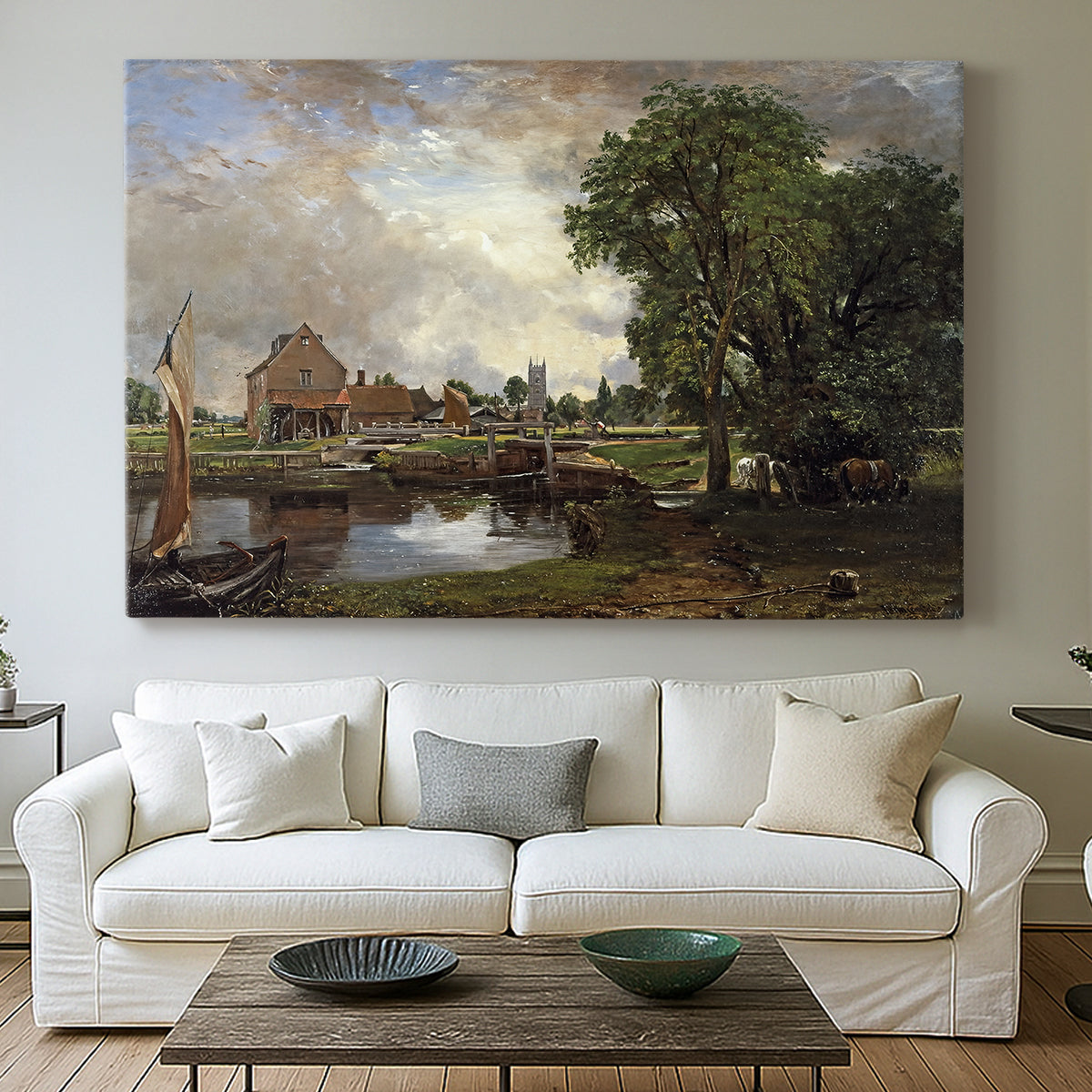 Canvas art print detailing a countryside view with mill and canal, centered above a sofa as a large focal wall piece