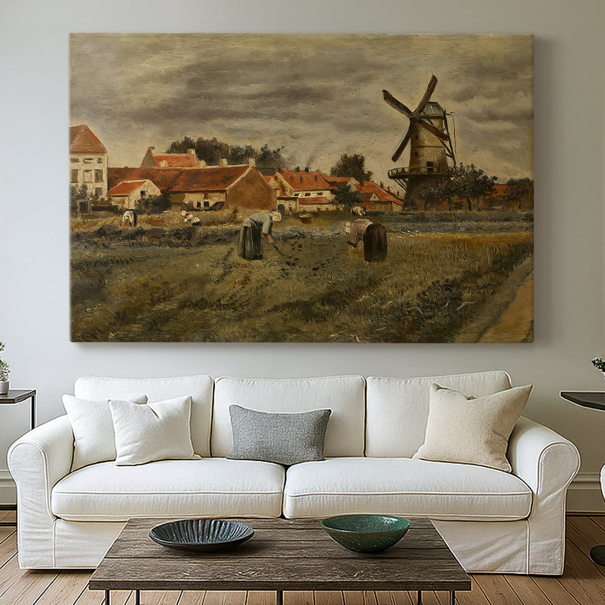 Canvas art print detailing an outdoor scene combining architecture and labor, centered above a sofa as a large focal wall piece