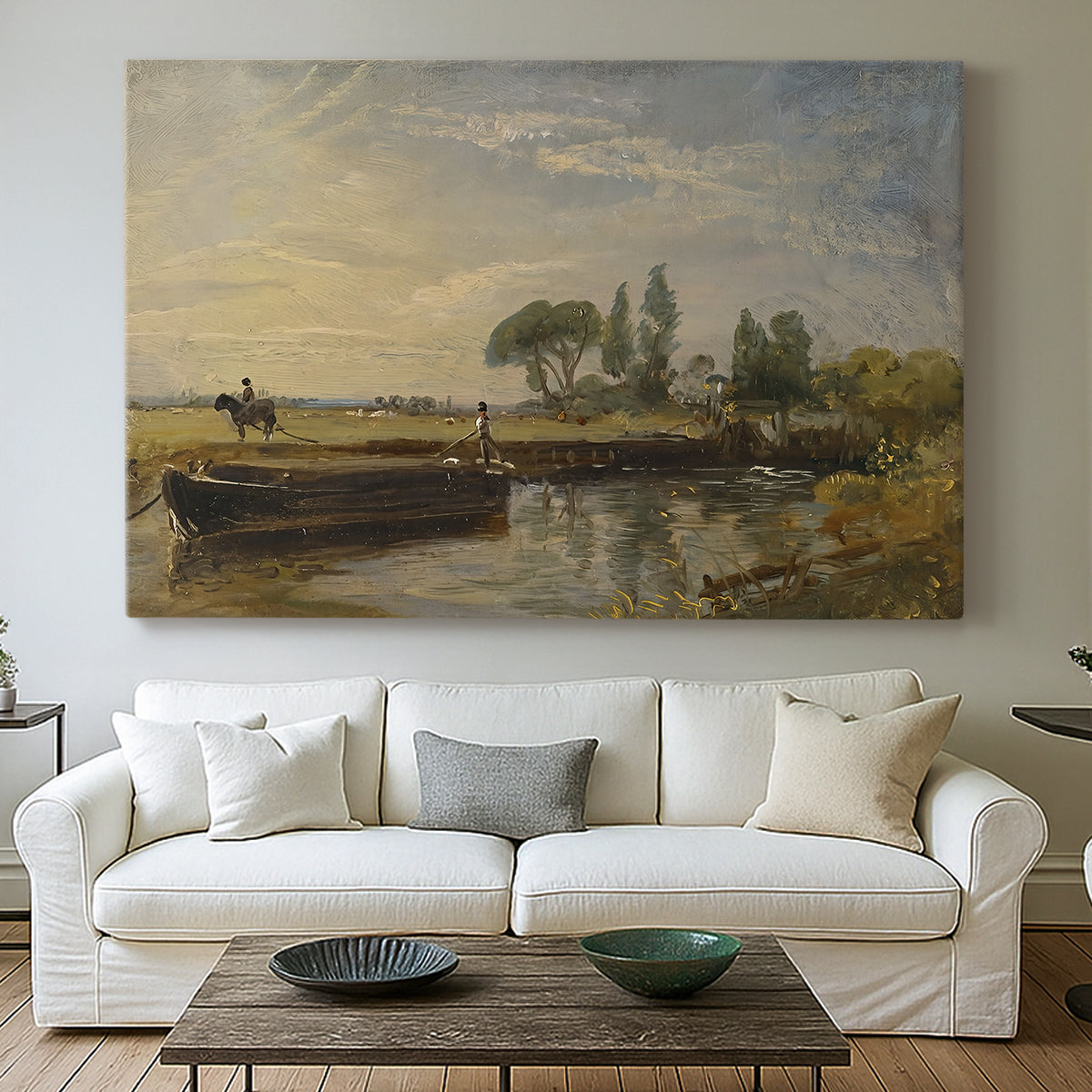 Canvas art print detailing a countryside view with barge and waterway, centered above a sofa as a large focal wall piece