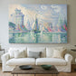 Canvas art print detailing a coastal composition with buildings, centered above a sofa as a large focal wall piece