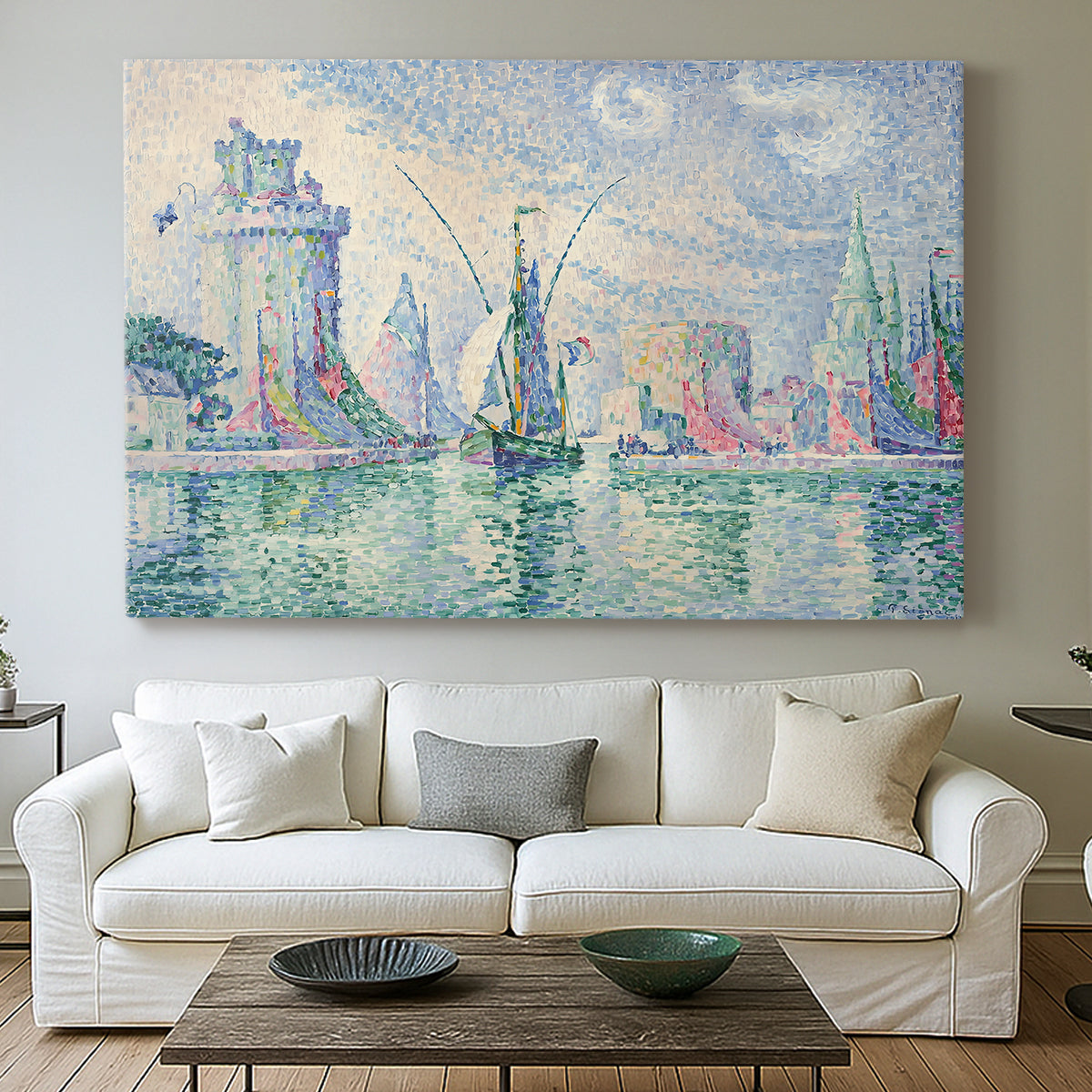 Canvas art print detailing a coastal composition with buildings, centered above a sofa as a large focal wall piece