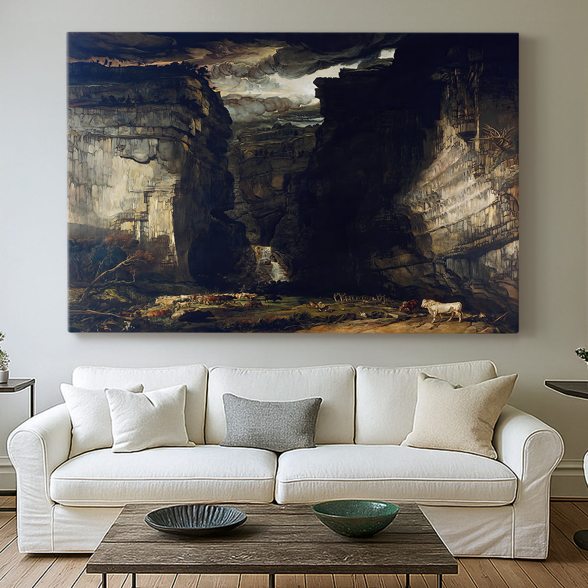 Canvas art print detailing an expansive geological landscape with dramatic elevation, centered above a sofa as a large focal wall piece