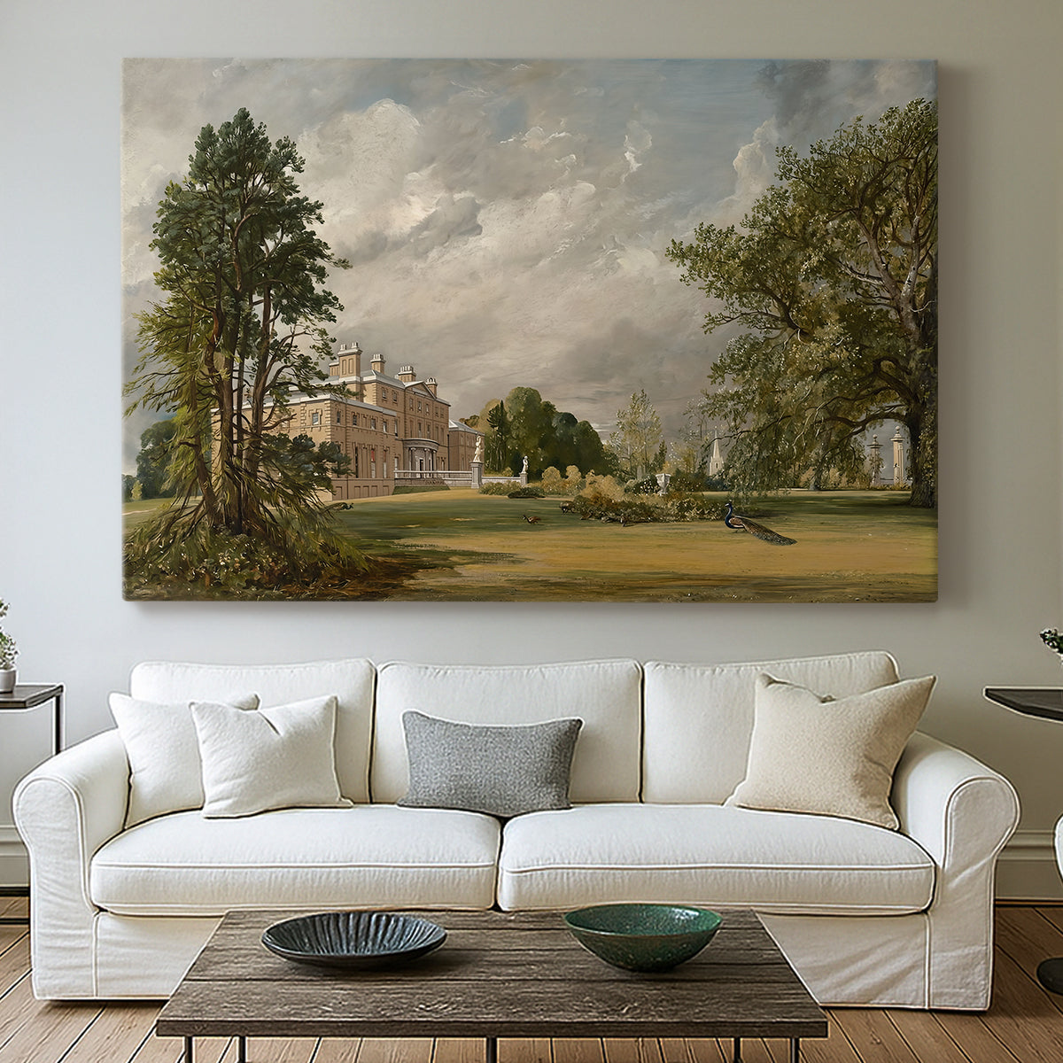Canvas art print detailing a countryside view with house and vegetation, centered above a sofa as a large focal wall piece