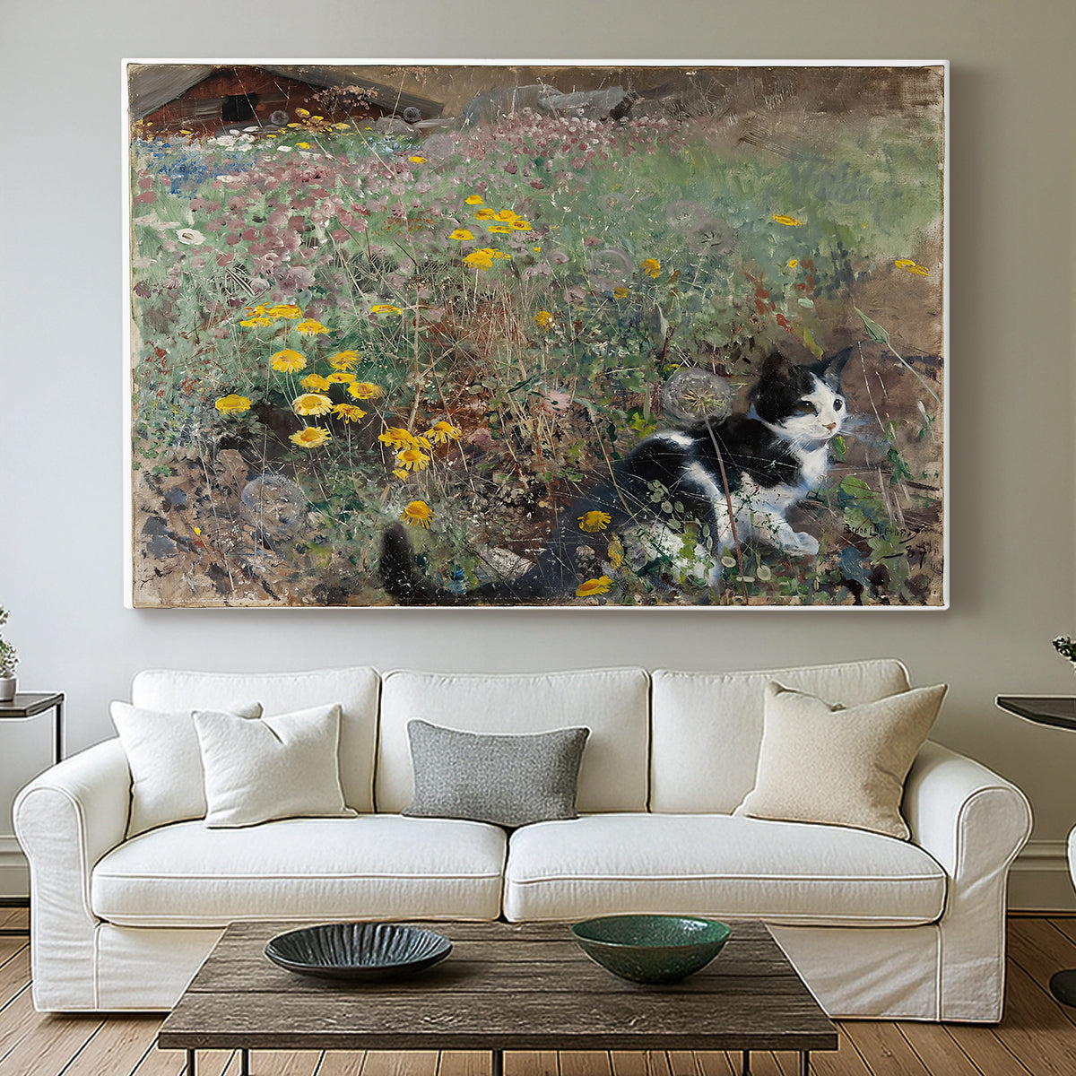 Canvas art print detailing a naturalistic depiction of cat in blooming countryside setting, centered above a sofa as a large focal wall piece