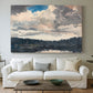 Canvas art print detailing a solitary boat set within natural woodland environment, centered above a sofa as a large focal wall piece