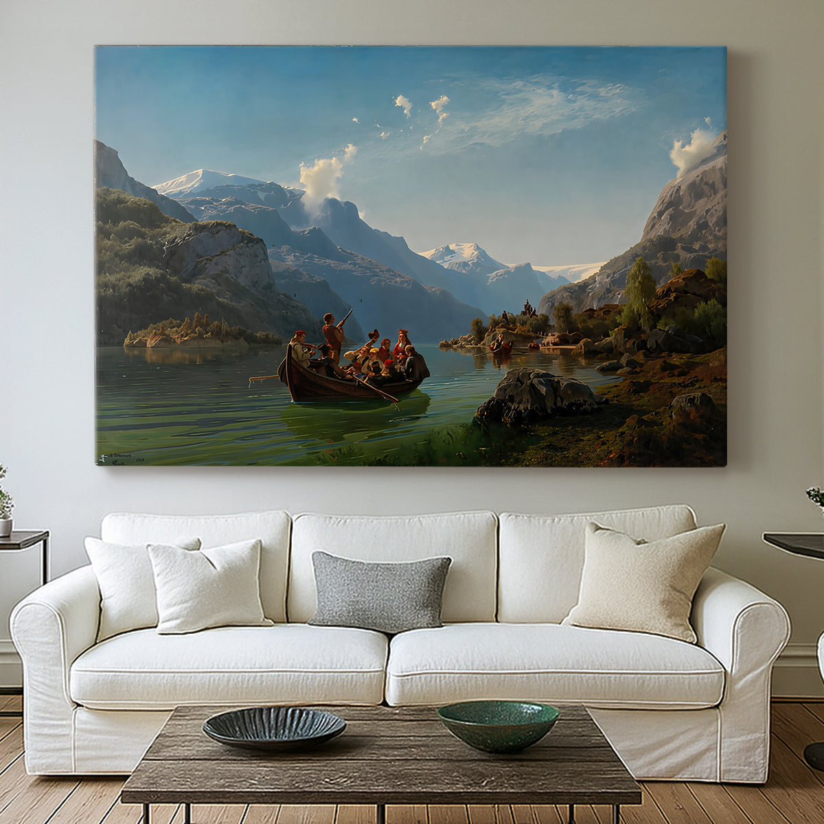 Canvas art print detailing a romantic landscape of boats on calm water beneath steep cliffs and mountains, centered above a sofa as a large focal wall piece