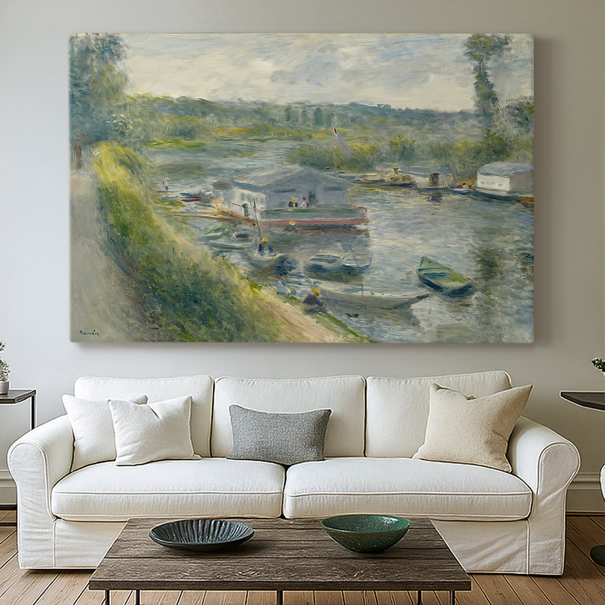 Canvas art print detailing an everyday life scene with boat and figures along river edge, centered above a sofa as a large focal wall piece