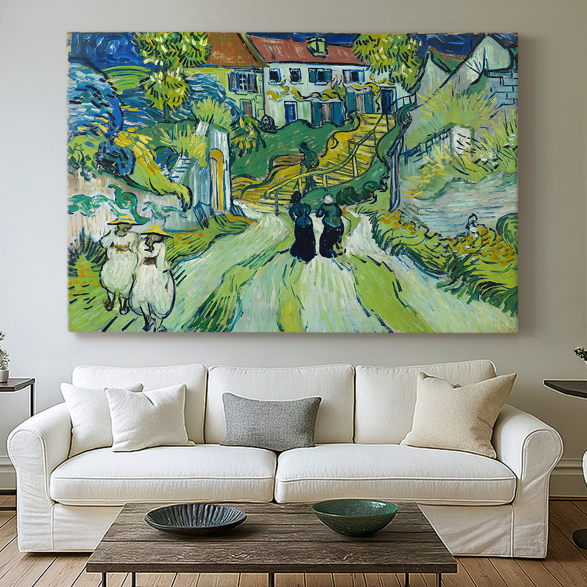 Canvas art print detailing a stylized cityscape with stairway and houses, centered above a sofa as a large focal wall piece
