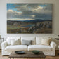 Canvas art print detailing a dramatic landscape with elevation and open sky, centered above a sofa as a large focal wall piece