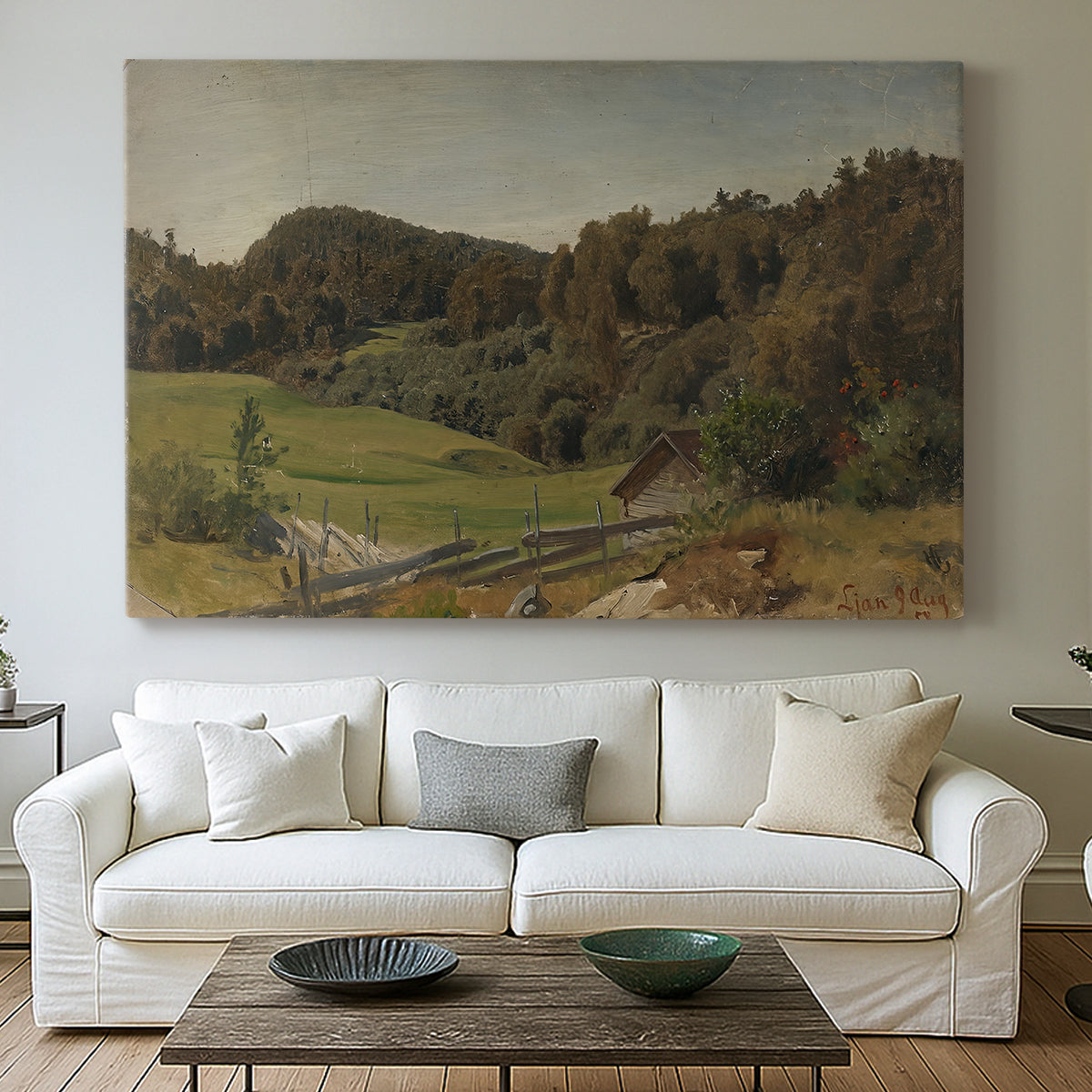 Canvas art print detailing a natural setting with vegetation and soft atmospheric light, centered above a sofa as a large focal wall piece