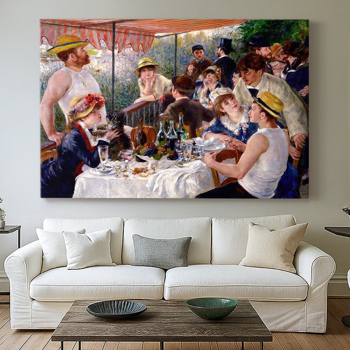 Canvas art print detailing a social dining scene with figures seated around table on riverside terrace, centered above a sofa as a large focal wall piece
