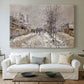 Canvas art print detailing an urban winter landscape with muted tones and soft light, centered above a sofa as a large focal wall piece